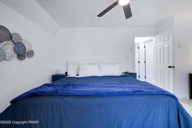 bedroom with ceiling fan and vaulted ceiling