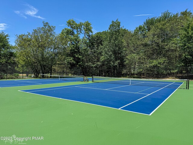 view of sport court with fence