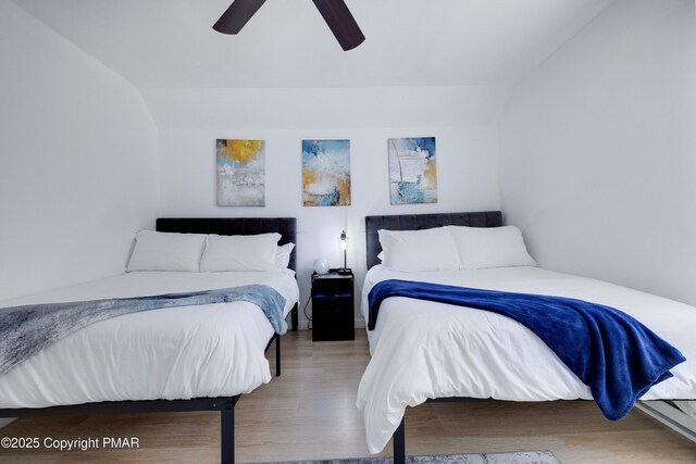 bedroom with wood finished floors and a ceiling fan