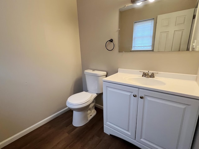211 Beaver Dam Rd, Long Pond, PA 18334 - bathroom featuring toilet, vanity, baseboards, and wood finished floors