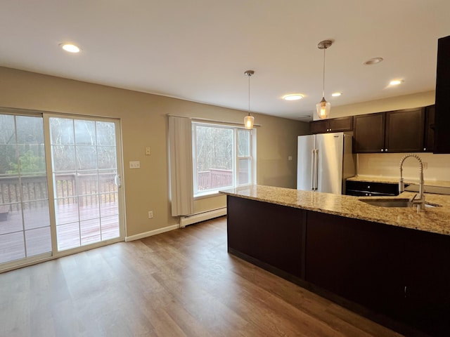 211 Beaver Dam Rd, Long Pond, PA 18334 - kitchen featuring high end refrigerator, a sink, baseboard heating, dark brown cabinets, and light stone countertops