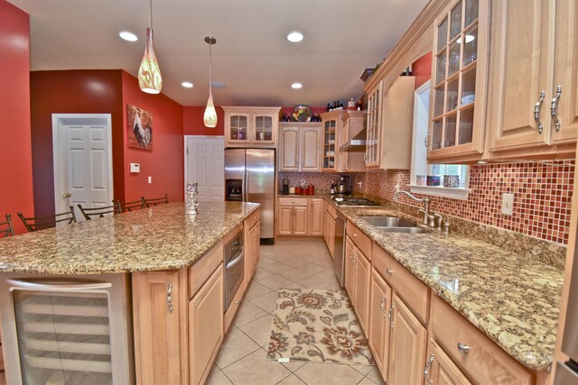 210 Edwin Ln, Stroudsburg, PA 18360 - kitchen featuring appliances with stainless steel finishes, beverage cooler, a sink, light tile patterned flooring, and backsplash