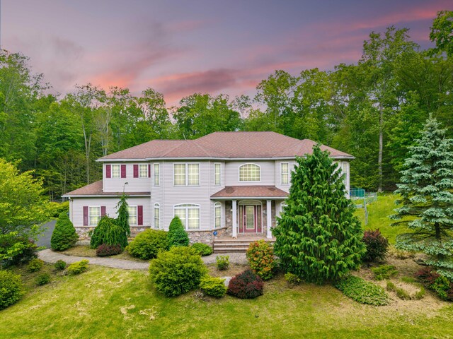 210 Edwin Ln, Stroudsburg, PA 18360 - colonial-style house featuring stone siding and a porch
