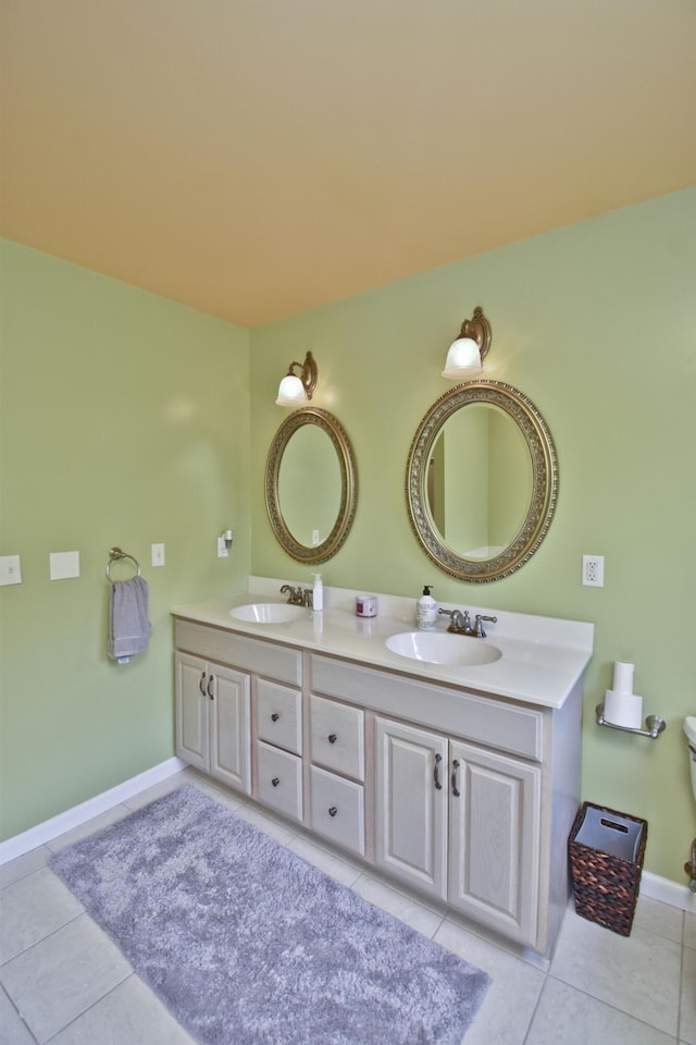 210 Edwin Ln, Stroudsburg, PA 18360 - full bathroom with double vanity, tile patterned flooring, baseboards, and toilet