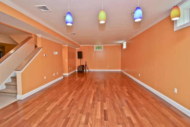 210 Edwin Ln, Stroudsburg, PA 18360 - finished below grade area with light wood finished floors, baseboards, ornamental molding, and stairs