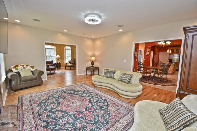 210 Edwin Ln, Stroudsburg, PA 18360 - living room with light wood finished floors, a chandelier, and recessed lighting