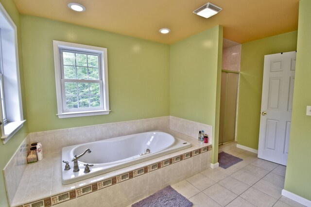 210 Edwin Ln, Stroudsburg, PA 18360 - bathroom featuring a bath, tile patterned flooring, a stall shower, and baseboards