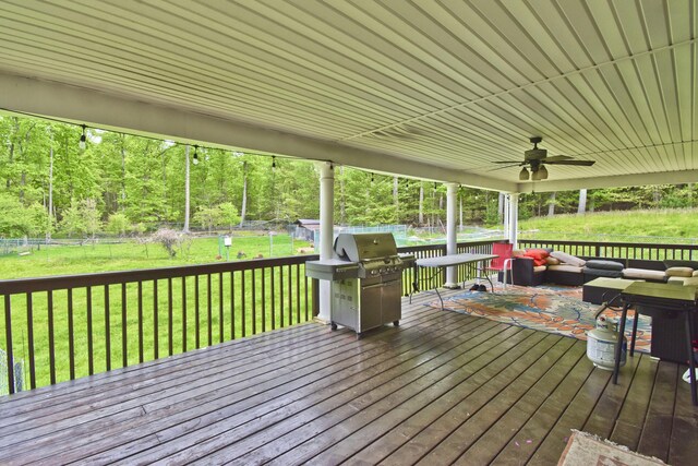 210 Edwin Ln, Stroudsburg, PA 18360 - wooden deck featuring outdoor lounge area, a ceiling fan, grilling area, and a view of trees