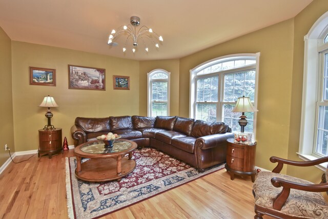 210 Edwin Ln, Stroudsburg, PA 18360 - living area with a chandelier, wood finished floors, and baseboards
