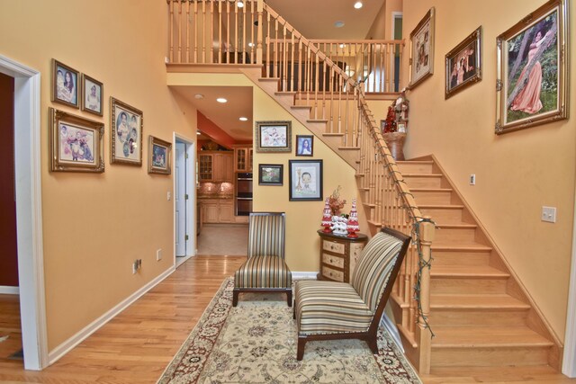 210 Edwin Ln, Stroudsburg, PA 18360 - stairway featuring a high ceiling, wood finished floors, baseboards, and recessed lighting