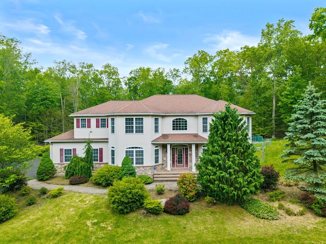 210 Edwin Ln, Stroudsburg, PA 18360 - colonial-style house with stone siding and a front lawn