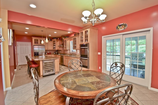 210 Edwin Ln, Stroudsburg, PA 18360 - dining room featuring wine cooler, light tile patterned flooring, a chandelier, baseboards, and recessed lighting