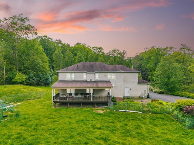 210 Edwin Ln, Stroudsburg, PA 18360 - back of property featuring a wooden deck and a forest view