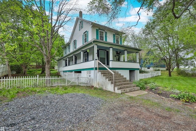 4216 W Grant St, Slatedale, PA 18079 - view of front of property featuring a chimney, a porch, stairway, and a fenced front yard