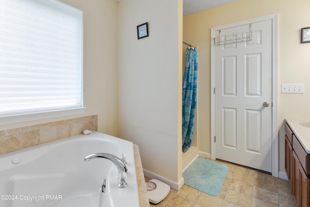 full bath with curtained shower, a garden tub, vanity, and baseboards