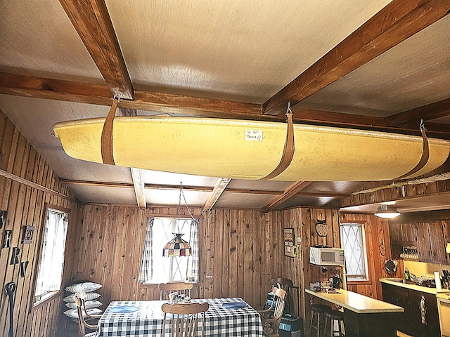 interior space with wood walls and a wealth of natural light