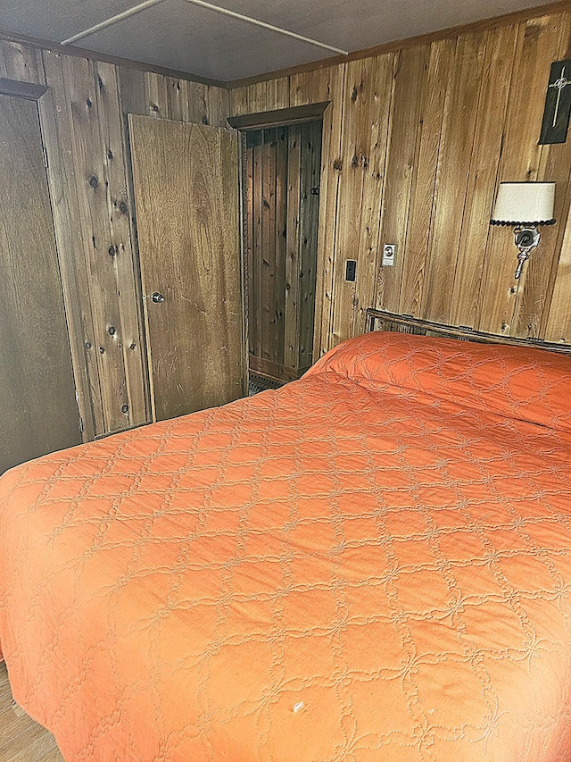 unfurnished bedroom featuring wooden walls