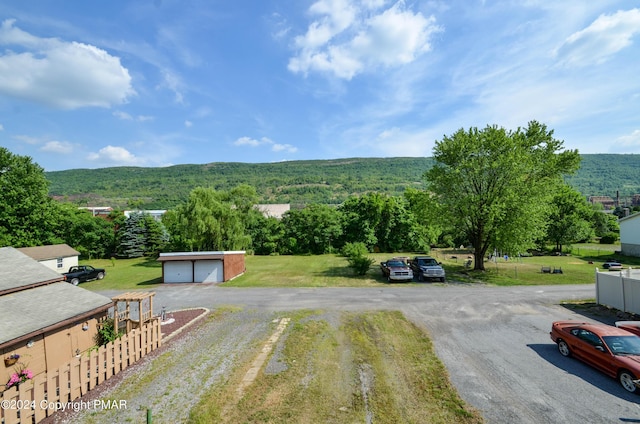 drone / aerial view with a wooded view