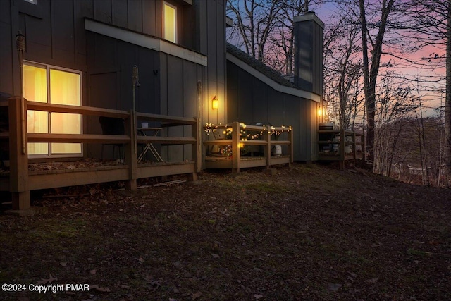 property exterior at dusk with board and batten siding