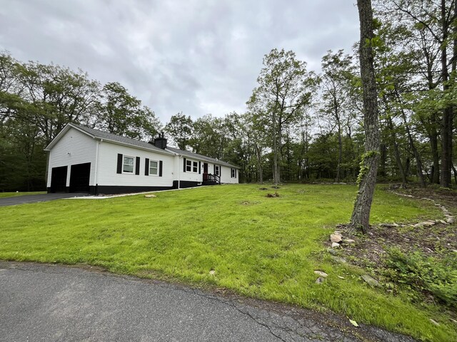 3015 Mountain Ter, Stroudsburg, PA 18360 - view of front facade with a front lawn and asphalt driveway