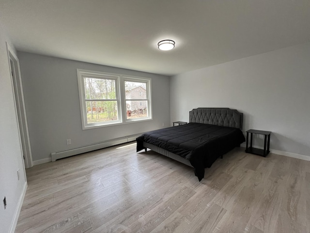 3015 Mountain Ter, Stroudsburg, PA 18360 - bedroom with baseboard heating and light wood-style floors