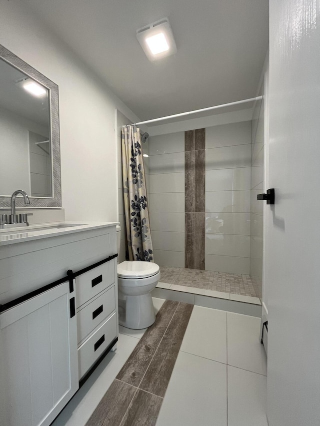3015 Mountain Ter, Stroudsburg, PA 18360 - bathroom featuring a tile shower, vanity, and tile patterned floors