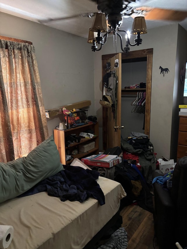 82 Pocono Rd, Albrightsville, PA 18210 - bedroom with a notable chandelier, a closet, and wood finished floors