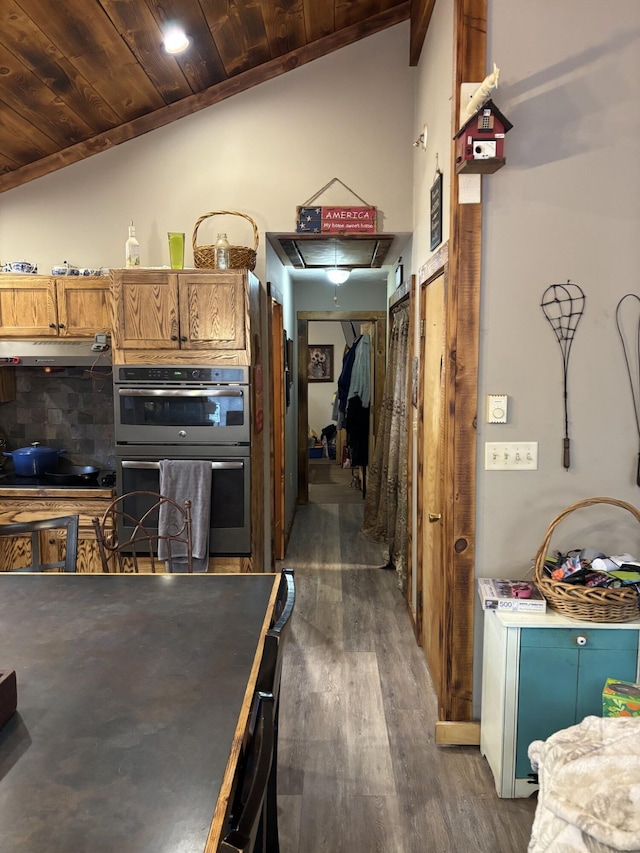 82 Pocono Rd, Albrightsville, PA 18210 - kitchen featuring under cabinet range hood, dark wood-type flooring, lofted ceiling, double oven, and wood ceiling