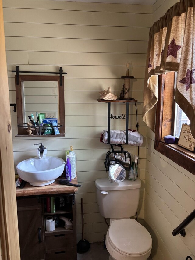 82 Pocono Rd, Albrightsville, PA 18210 - half bathroom with toilet, vanity, and wooden walls