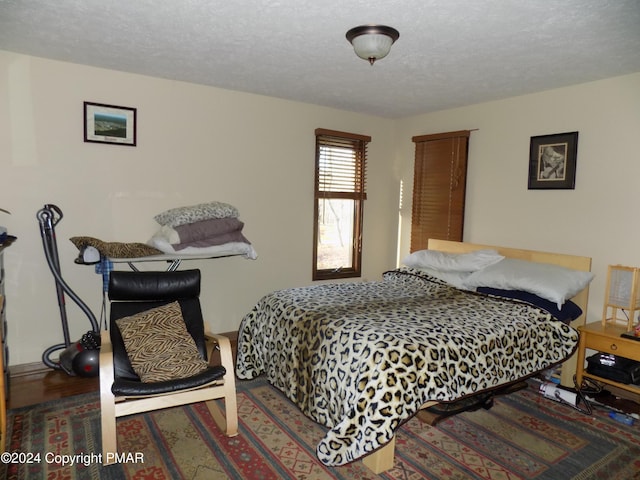 bedroom featuring a textured ceiling