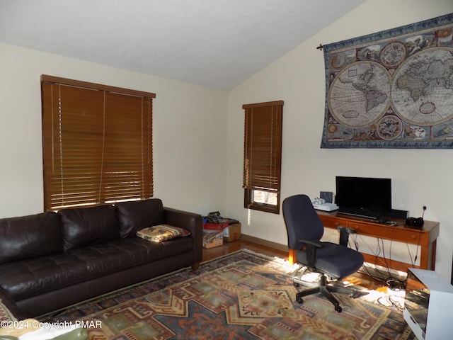 office area featuring vaulted ceiling