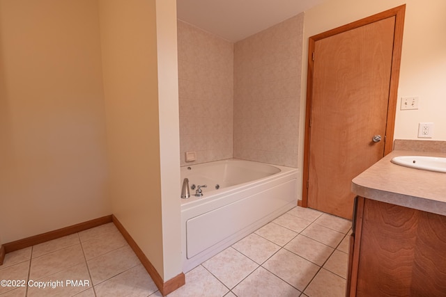 bathroom featuring vanity, tile patterned floors, and a tub