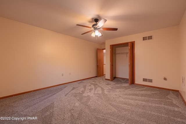 unfurnished bedroom with ceiling fan and light colored carpet