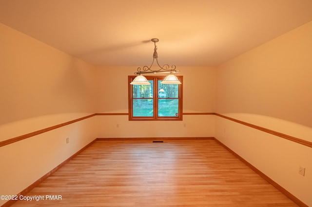 spare room featuring hardwood / wood-style floors