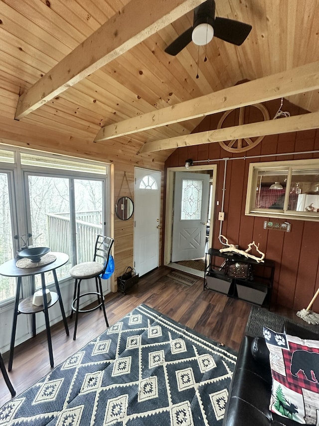 entrance foyer featuring wooden ceiling, ceiling fan, vaulted ceiling with beams, and a healthy amount of sunlight