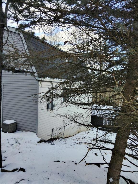 106 Lakota Rd, East Stroudsburg, PA 18302 - view of snowy exterior featuring roof with shingles