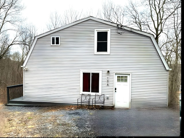 106 Lakota Rd, East Stroudsburg, PA 18302 - back of house featuring a gambrel roof and a wooden deck