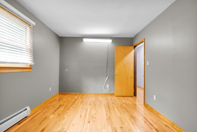 4620 Buck Valley Cir E, Stroudsburg, PA 18301 - empty room with baseboard heating and wood finished floors