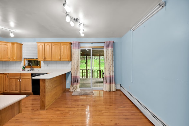 4620 Buck Valley Cir E, Stroudsburg, PA 18301 - kitchen featuring a baseboard heating unit, black dishwasher, light wood-style floors, decorative backsplash, and light countertops