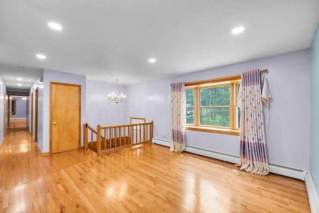 4620 Buck Valley Cir E, Stroudsburg, PA 18301 - spare room with light wood-type flooring, baseboard heating, a chandelier, and recessed lighting