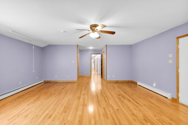 4620 Buck Valley Cir E, Stroudsburg, PA 18301 - spare room featuring a baseboard heating unit, a ceiling fan, and light wood-type flooring