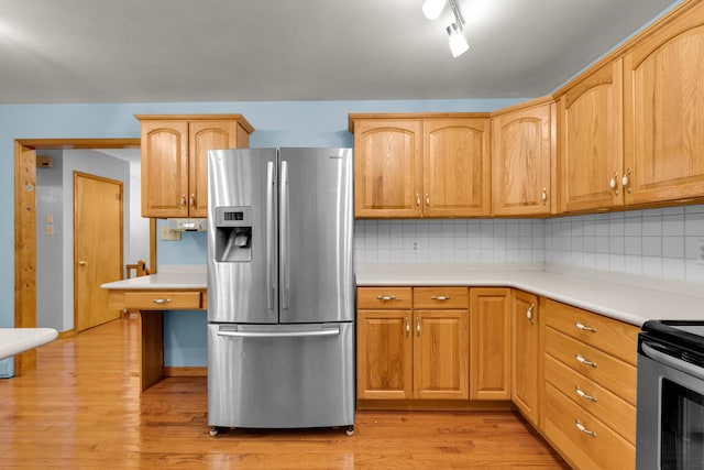 4620 Buck Valley Cir E, Stroudsburg, PA 18301 - kitchen featuring appliances with stainless steel finishes, light wood finished floors, tasteful backsplash, and light countertops