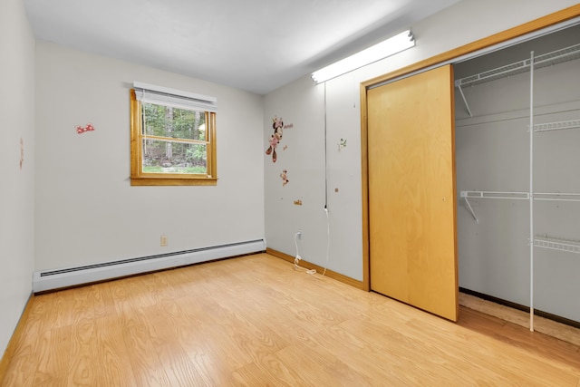 4620 Buck Valley Cir E, Stroudsburg, PA 18301 - unfurnished bedroom featuring a baseboard radiator, wood finished floors, and a closet