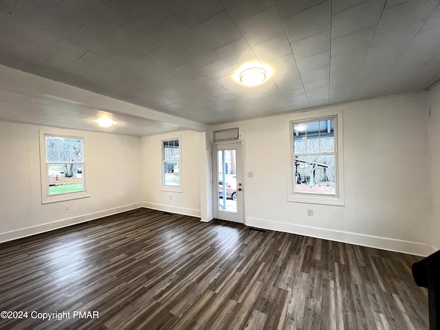 entrance foyer featuring dark wood-style flooring and baseboards