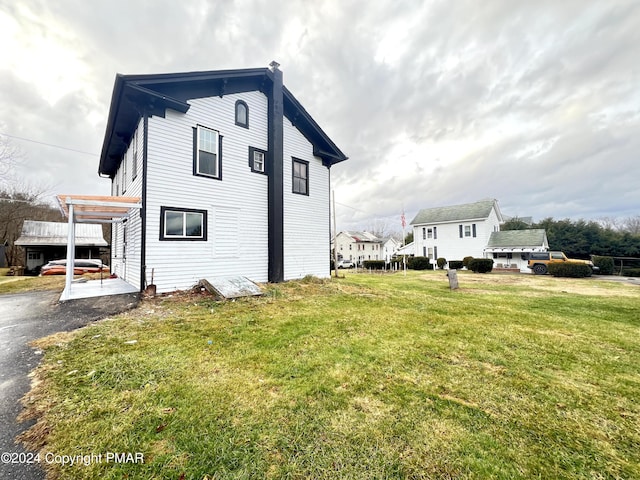 view of home's exterior featuring a yard