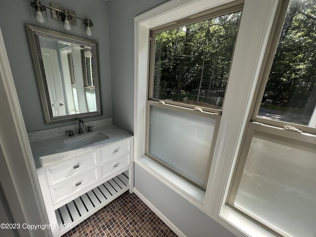 bathroom with baseboards and vanity