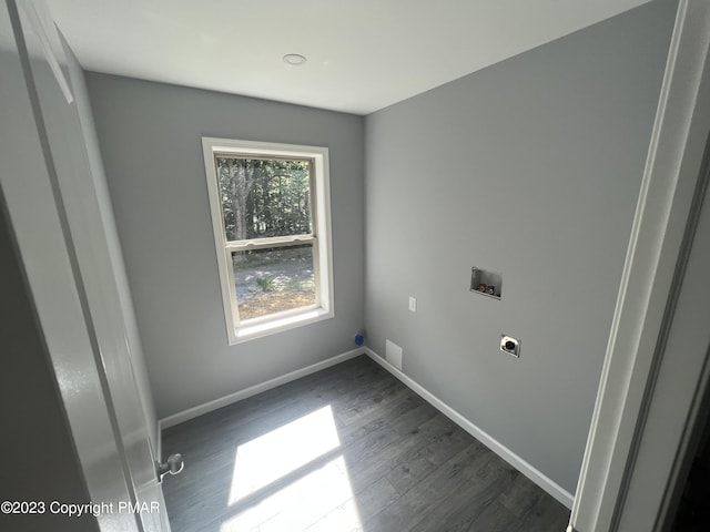 washroom featuring laundry area, baseboards, dark wood-style flooring, hookup for a washing machine, and electric dryer hookup