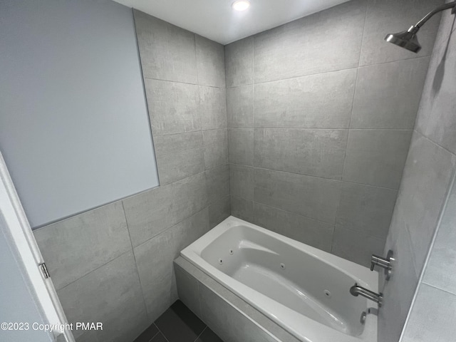 full bath with tile walls