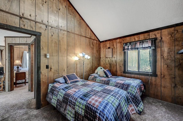 carpeted bedroom featuring vaulted ceiling and wood walls