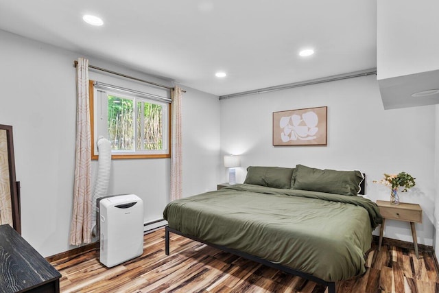 322 Clubhouse Dr, East Stroudsburg, PA 18302 - bedroom featuring a baseboard heating unit, wood finished floors, recessed lighting, and baseboards